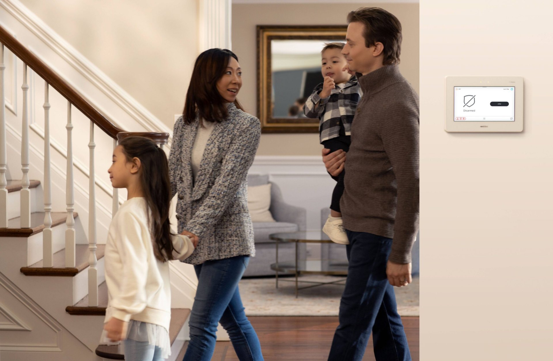 Family entering a home protected by a Resideo Pro Series alarm panel