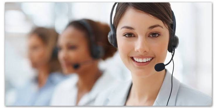 Friendly monitoring center operator with a headset ready to respond to alarms
